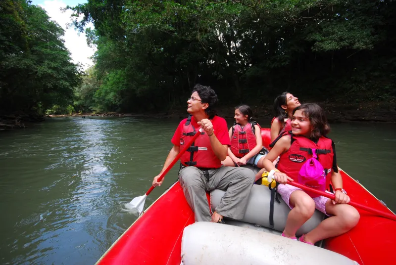 family on a safari float in la fortuna