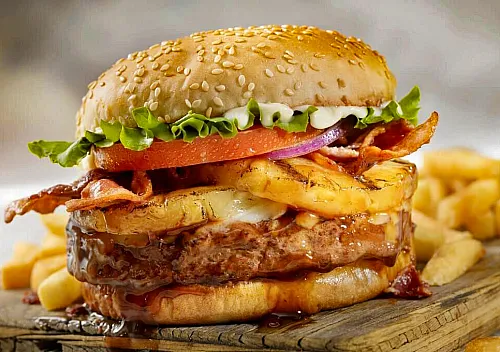 hamburger with pineapple and french fries la fortuna costa rica